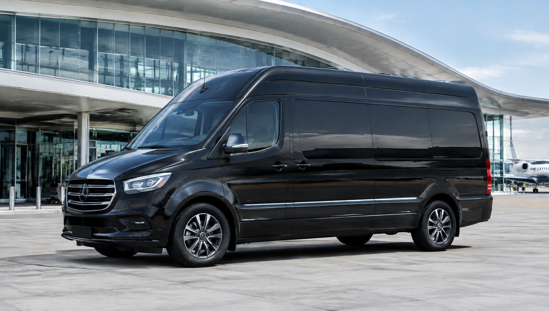 Executive van with conference seating parked at night